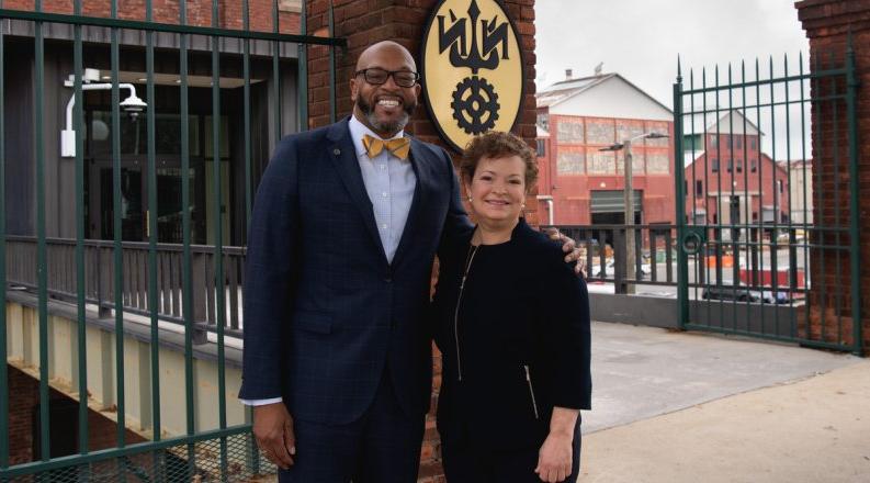 Photo of a man and a woman standing together.